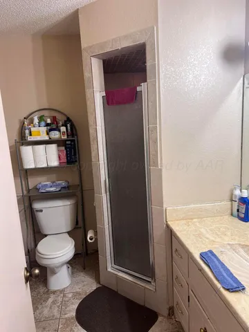 a bathroom with a toilet and a sink