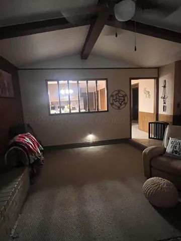 a outdoor kitchen with a stove a sink and a refrigerator