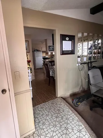 a bedroom with furniture and a wooden floor