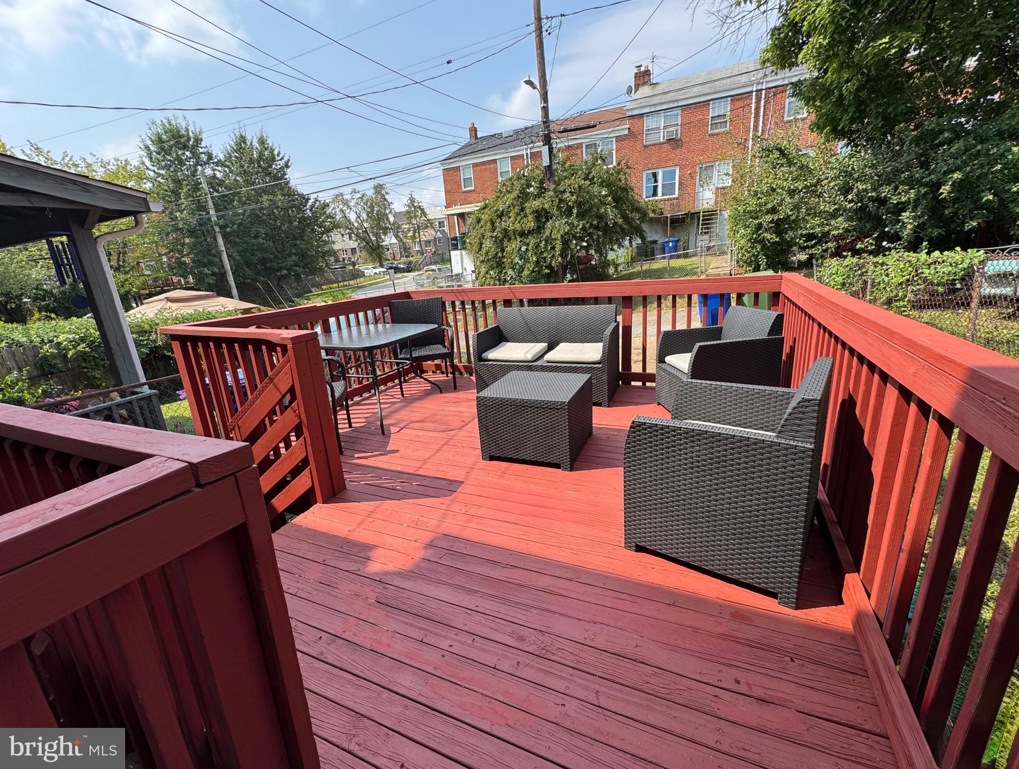 3804 Rexmere Road Baltimore, MD 21218 - Photo 45 of 45 a view of a roof deck with couches wooden floor and fence