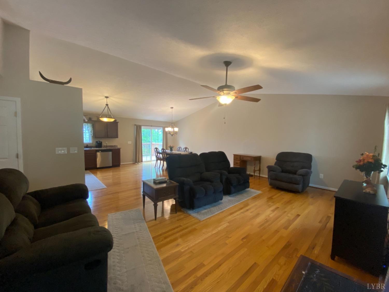 533 Pumping Station Road Spout Spring, VA 24593 - Photo 3 of 19 a living room with furniture and a chandelier