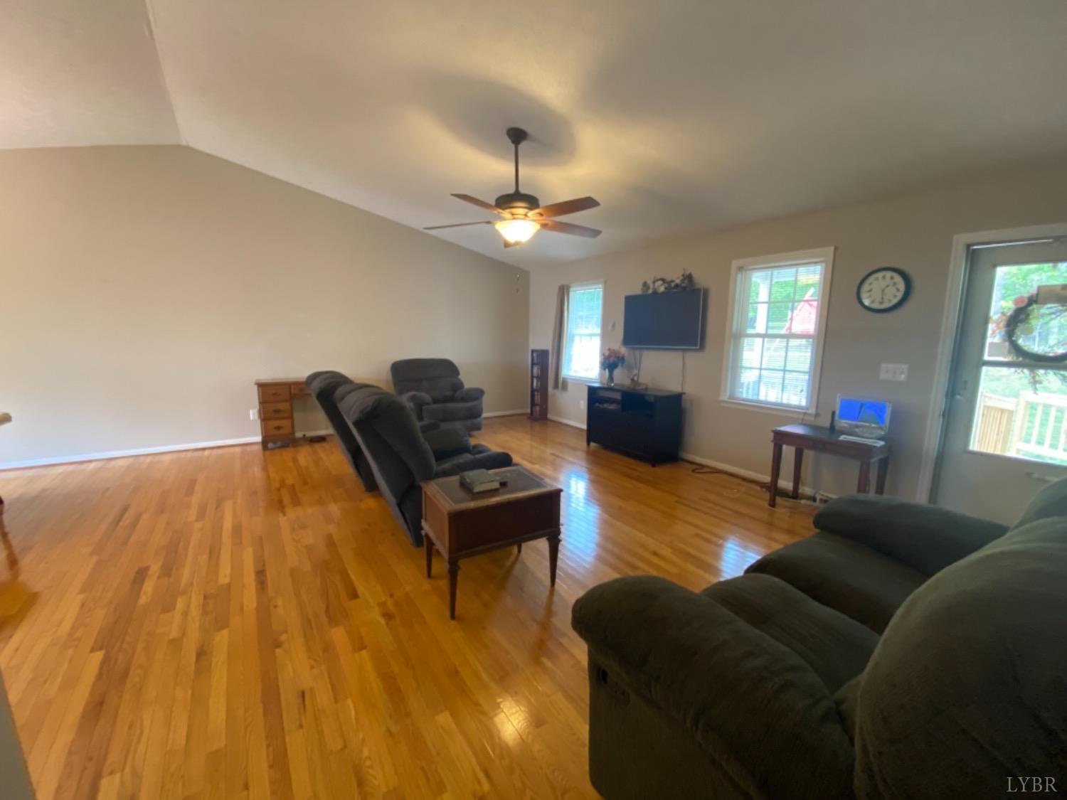 533 Pumping Station Road Spout Spring, VA 24593 - Photo 5 of 19 a living room with furniture and a chandelier