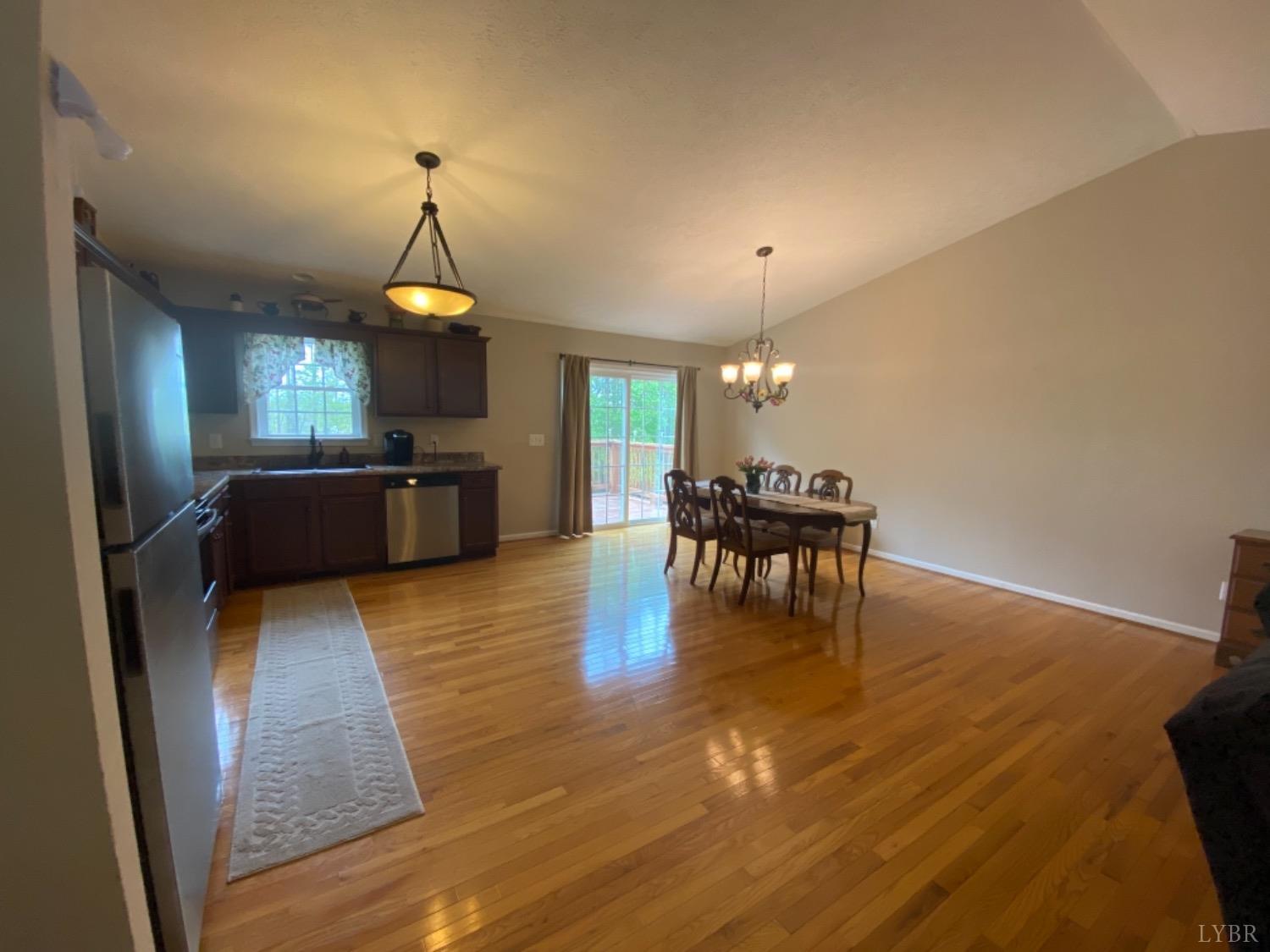 533 Pumping Station Road Spout Spring, VA 24593 - Photo 7 of 19 a living room with fireplace furniture and a wooden floor