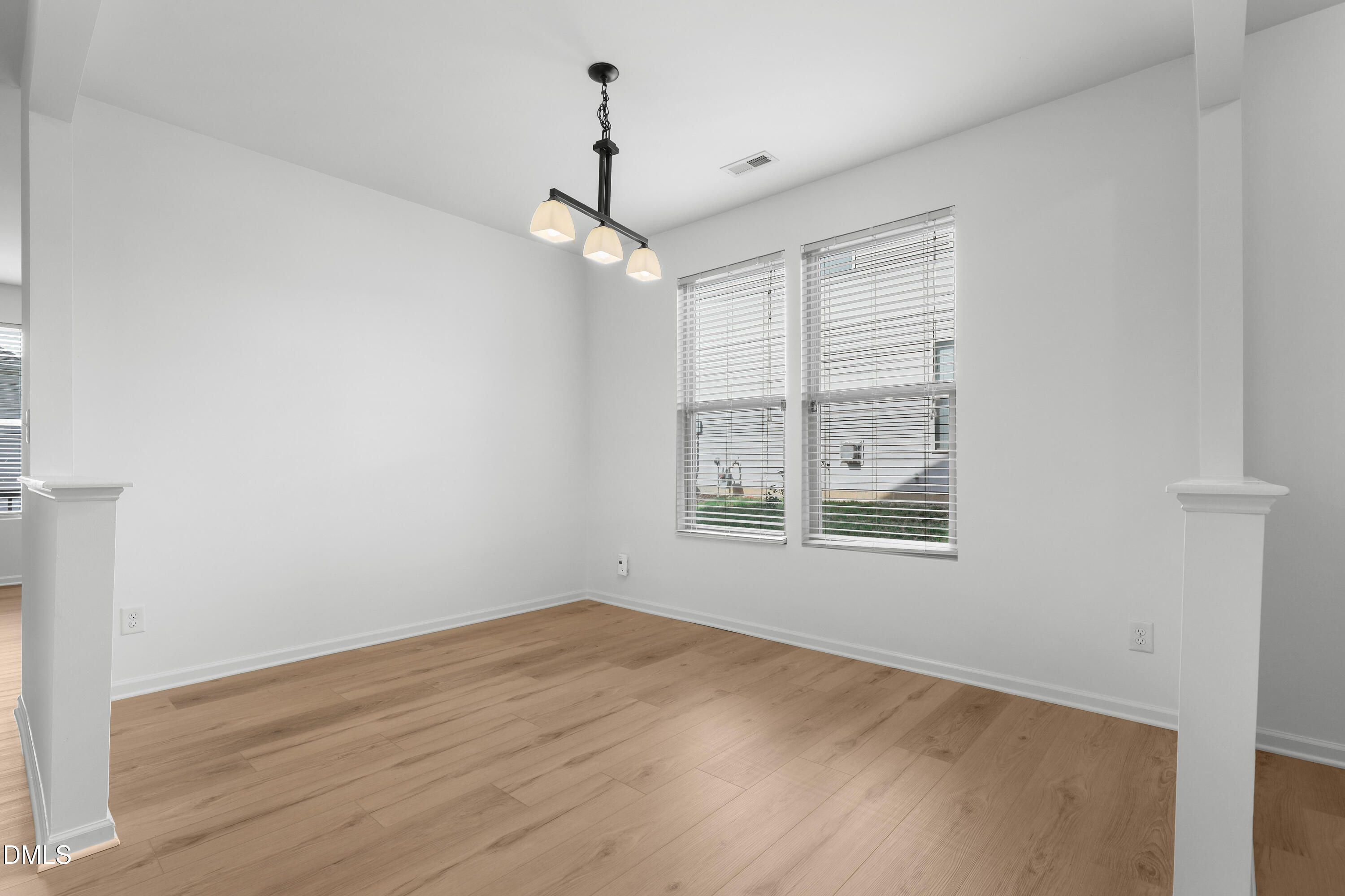 4400 Hillsgrove Road Wake Forest, NC 27587 - Photo 2 of 49 wooden floor in an empty room with a window