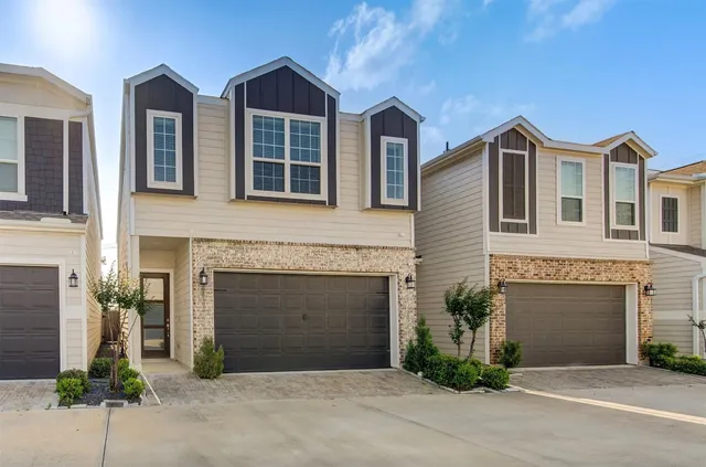 a front view of a house with yard