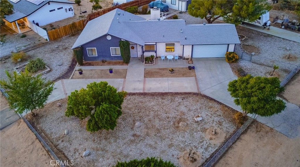 21114 Sioux Road Apple Valley, CA 92308 - Photo 1 of 1 an aerial view of a house with a yard and a yard
