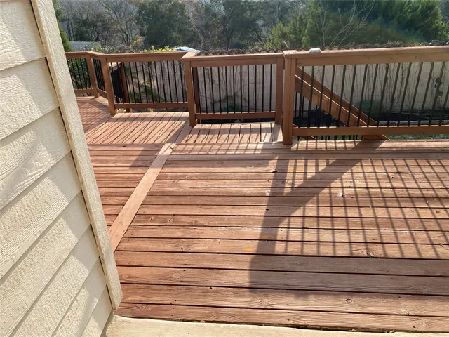 a view of balcony with wooden floor
