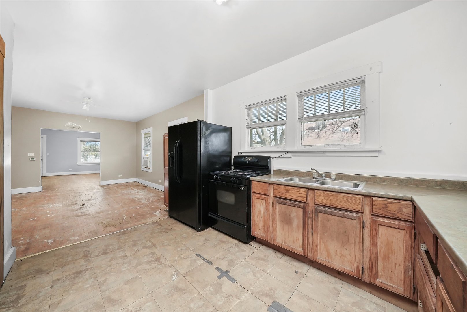 2405 North Club Road McHenry, IL 60051 - Photo 14 of 25 a kitchen with granite countertop a refrigerator and a stove top oven