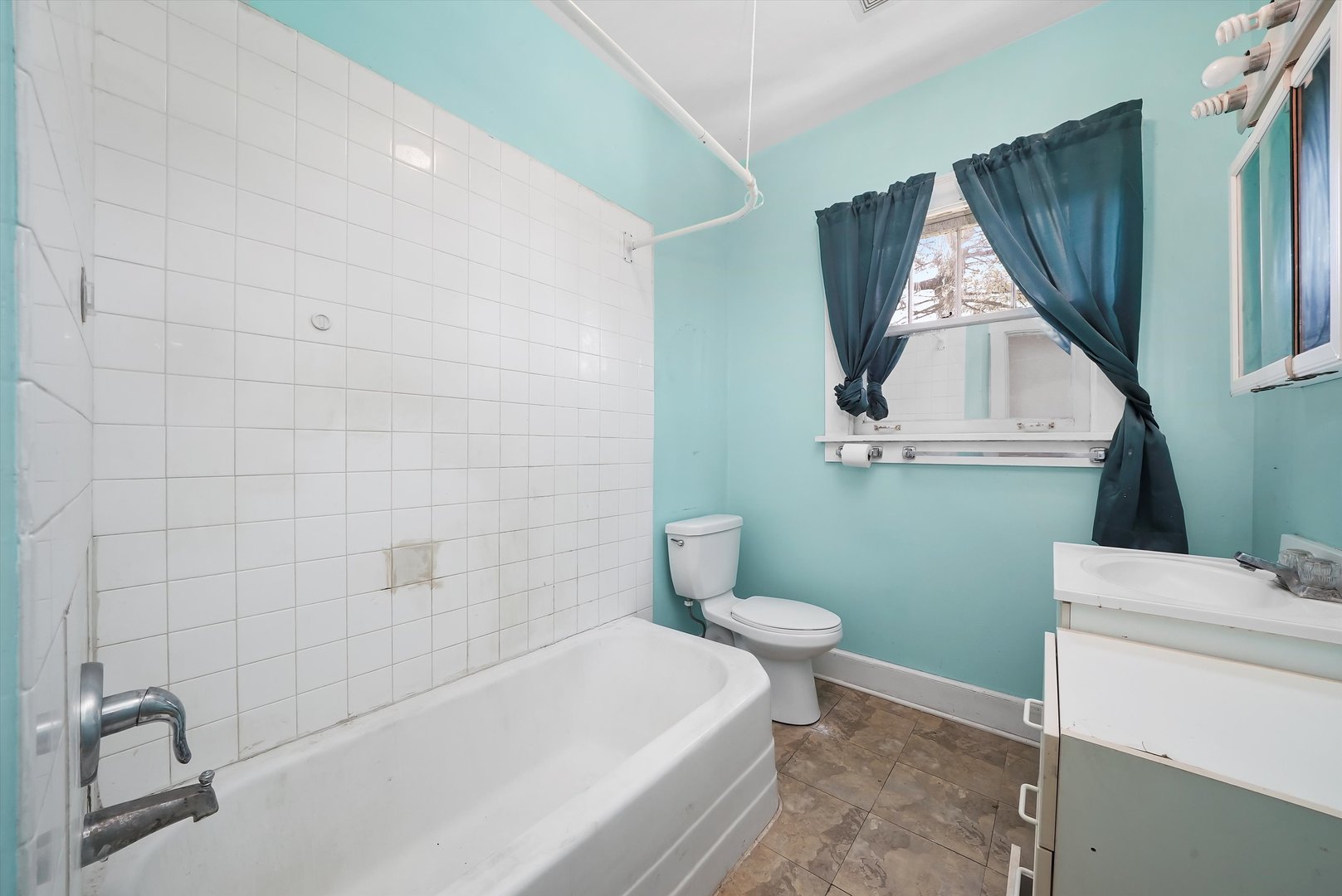 2405 North Club Road McHenry, IL 60051 - Photo 17 of 25 a bathroom with a sink a toilet and a mirror