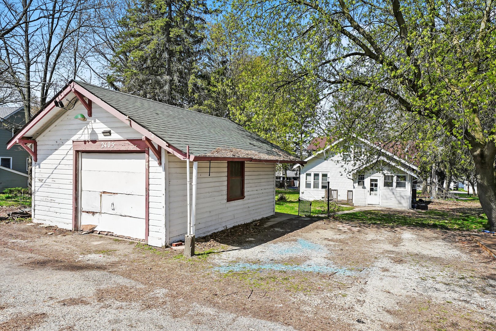 2405 North Club Road McHenry, IL 60051 - Photo 4 of 25 a front view of a house with a yard and garage