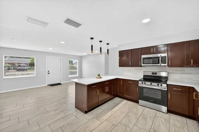 a spacious bathroom with a sink double vanity and a mirror