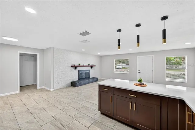 a view of an empty room and wooden floor