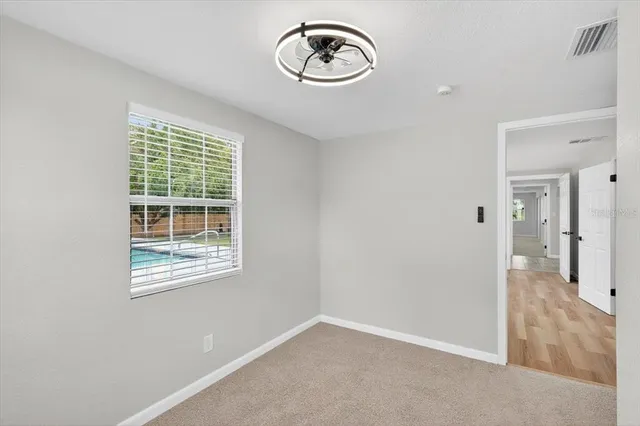 a view of a chandelier fan in a room