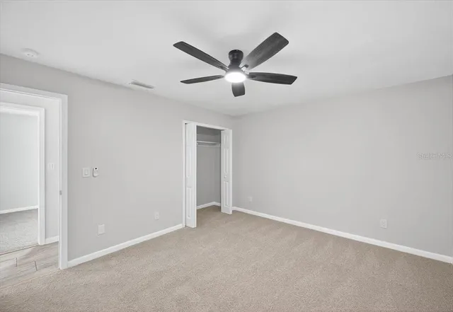 a view of a big room with carpet