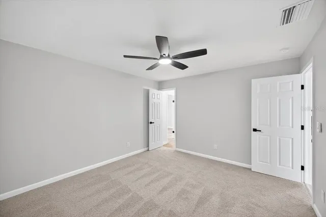 a view of a livingroom with a fireplace and window