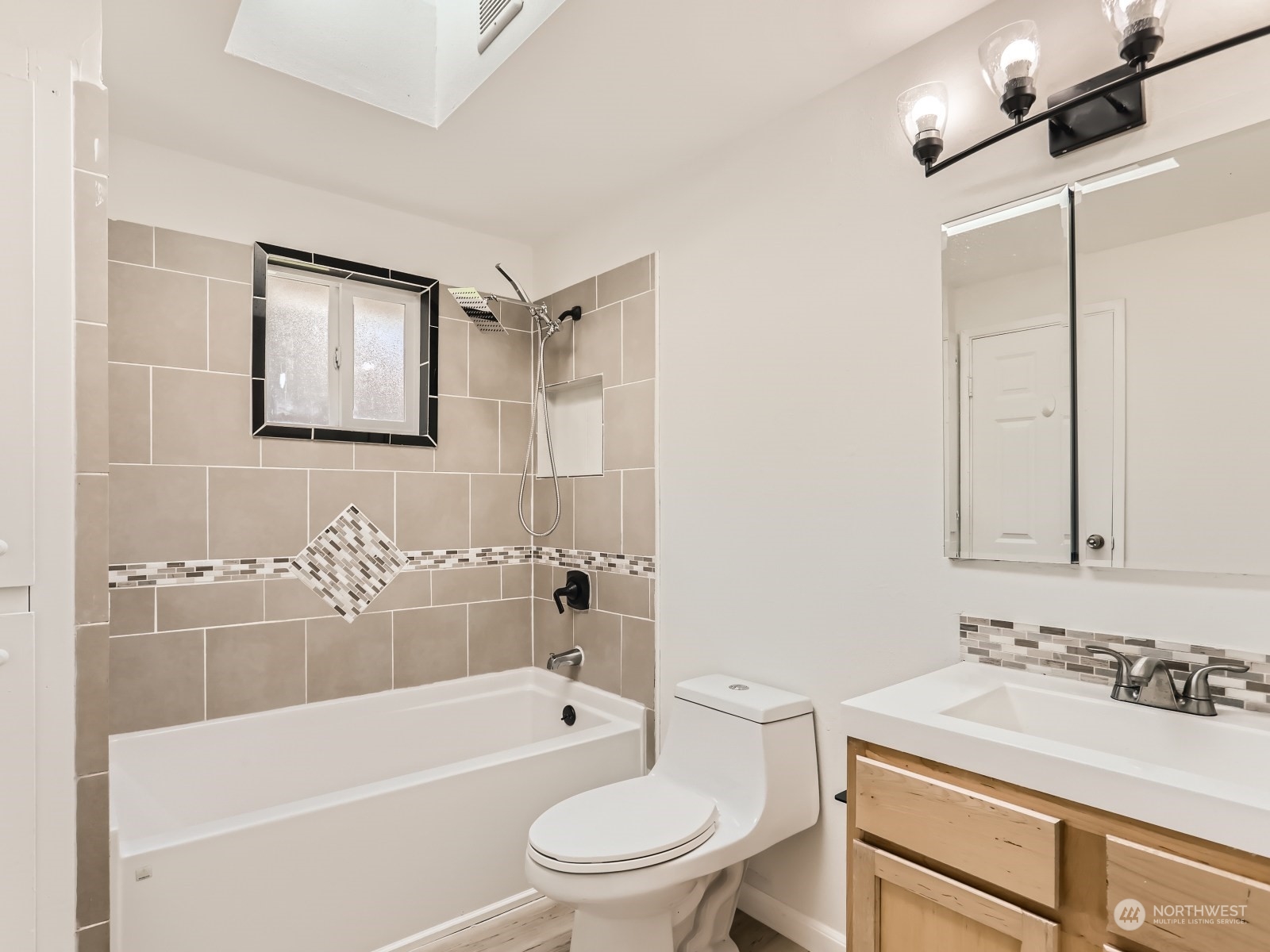 9211 3rd Place Southeast Everett, WA 98208 - Photo 18 of 20 a bathroom with a sink toilet vanity and shower
