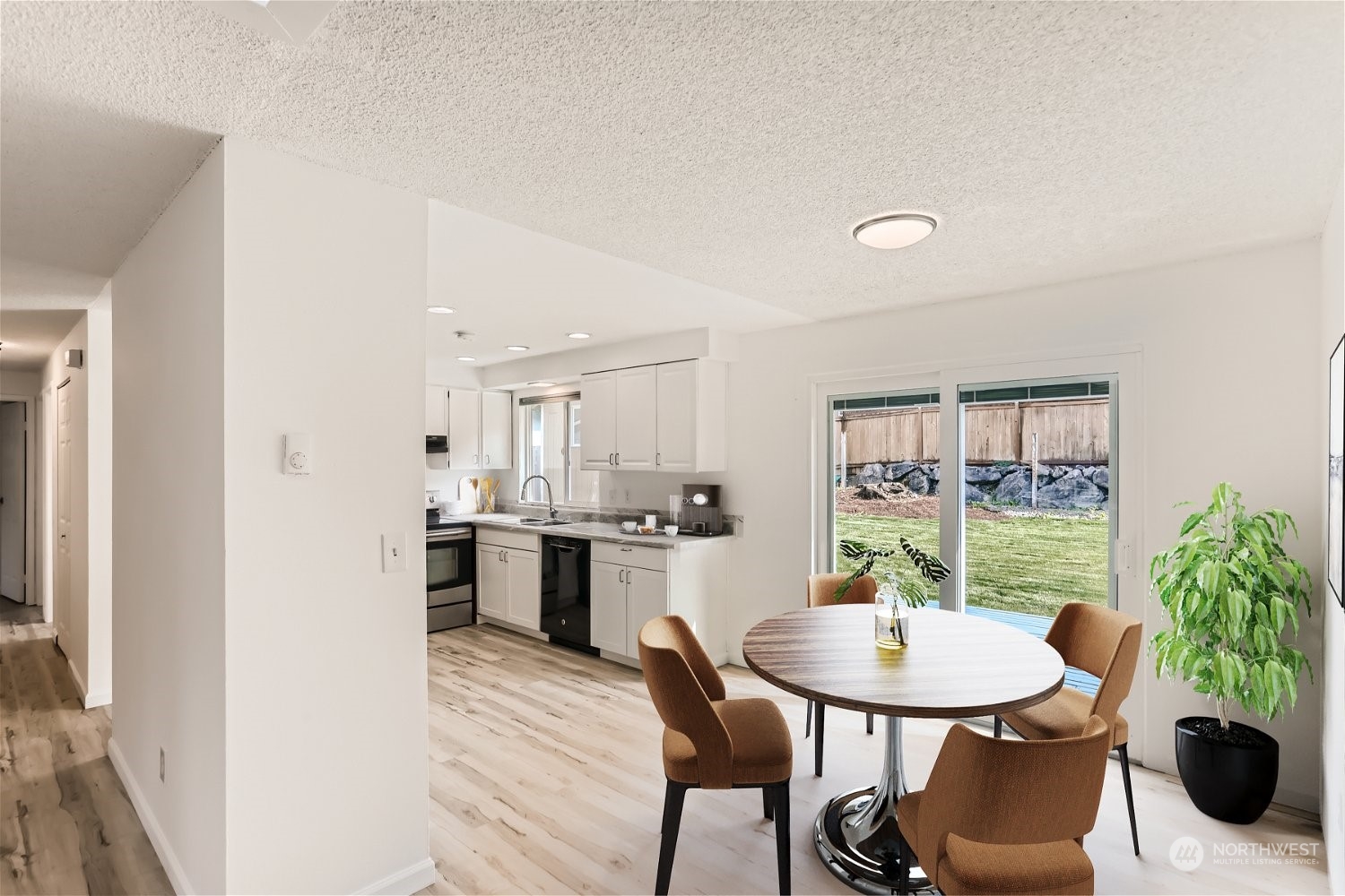 9211 3rd Place Southeast Everett, WA 98208 - Photo 5 of 20 a kitchen with a table and chairs in it