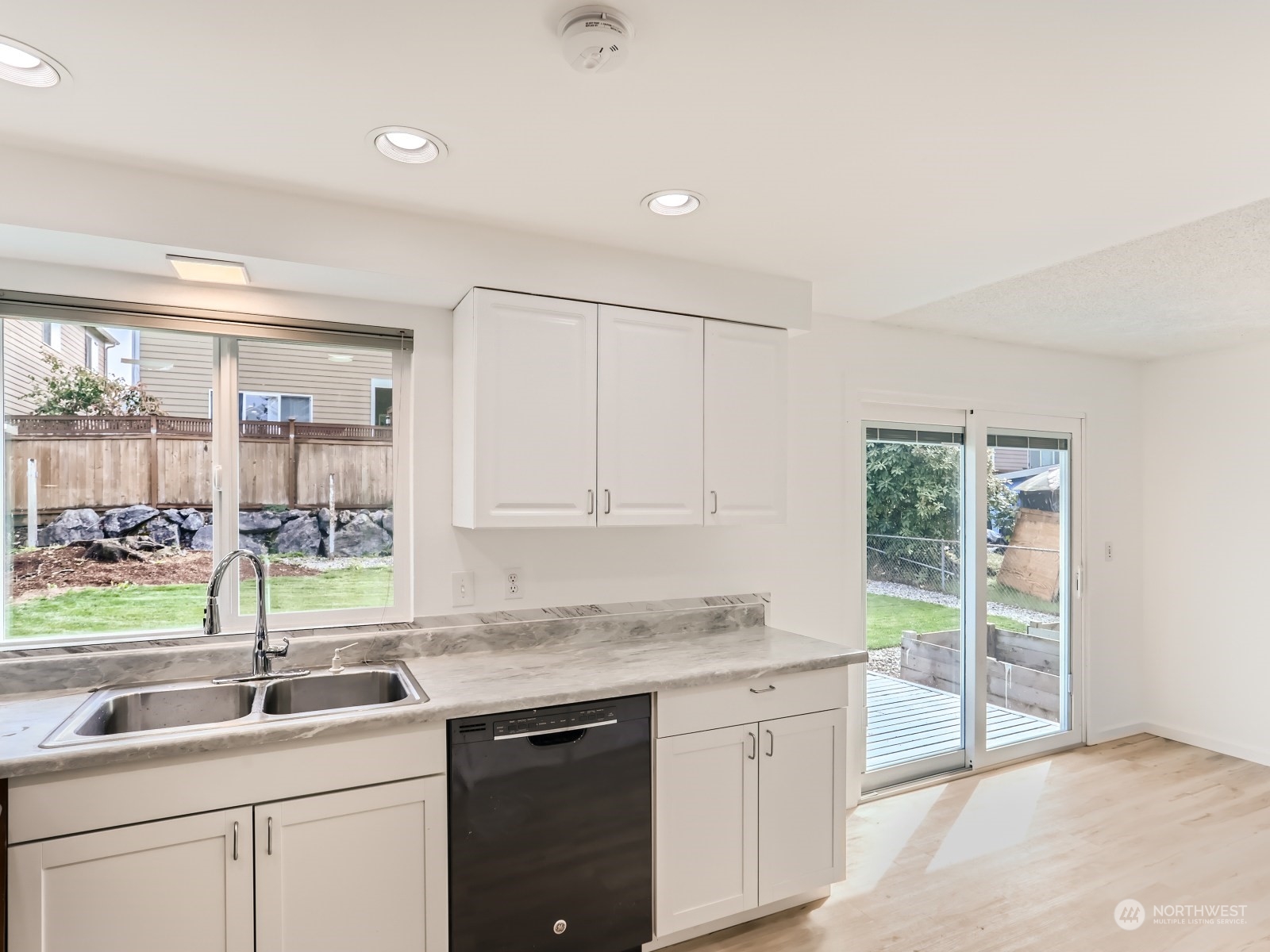 9211 3rd Place Southeast Everett, WA 98208 - Photo 8 of 20 a kitchen with sink cabinets and window