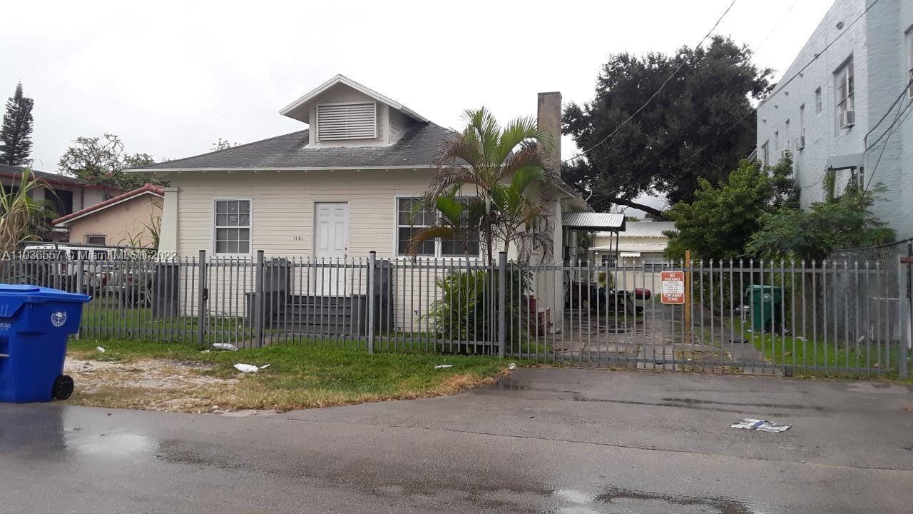 1759 Northwest 18th Terrace Miami, FL 33125 - Photo 2 of 10 a front view of house with yard and green space