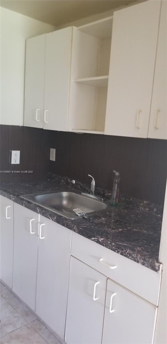 1759 Northwest 18th Terrace Miami, FL 33125 - Photo 7 of 10 a view of cabinets
