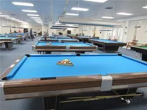 a kitchen with kitchen island granite countertop a stove and a refrigerator