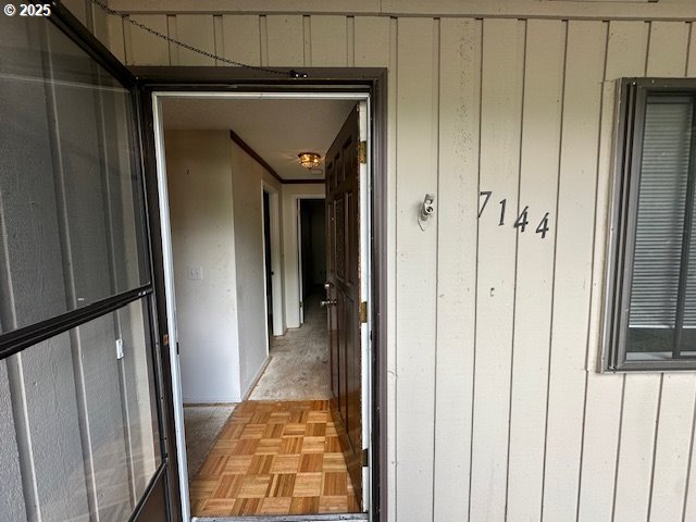 7144 Southwest Murray Boulevard Beaverton, OR 97008 - Photo 4 of 12 a view of a hallway with wooden floor and closet