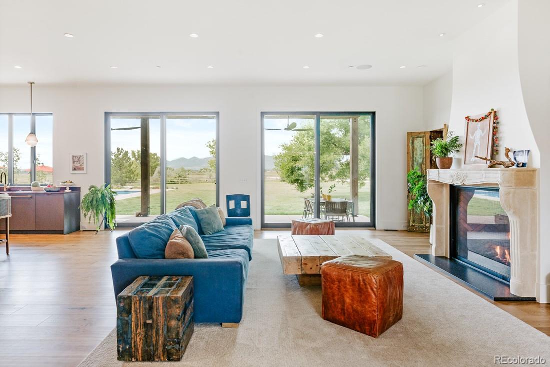 6122 Monarch Road Longmont, CO 80503 - Photo 12 of 40 a living room with fireplace furniture and a large window