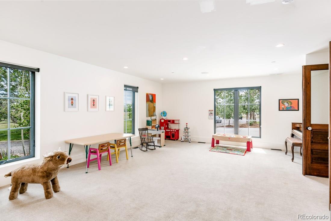 6122 Monarch Road Longmont, CO 80503 - Photo 15 of 40 a living room with furniture and a flat screen tv