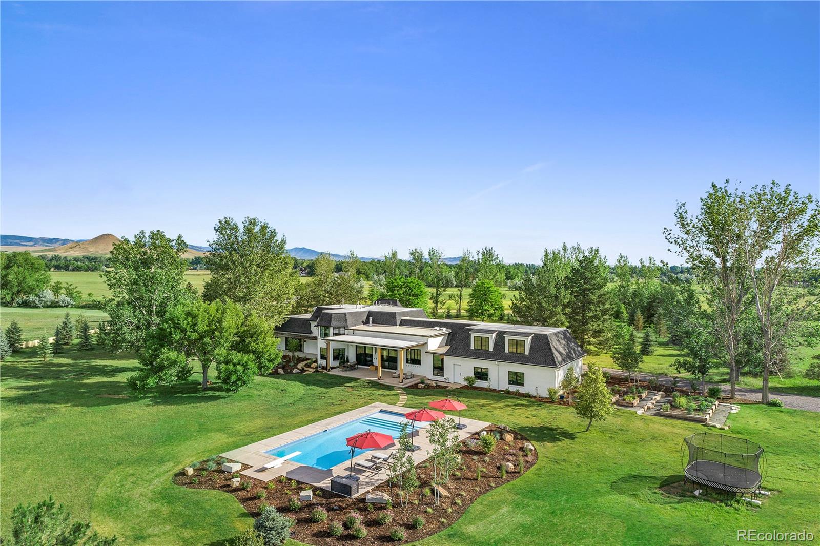 6122 Monarch Road Longmont, CO 80503 - Photo 18 of 40 a front view of a house with garden
