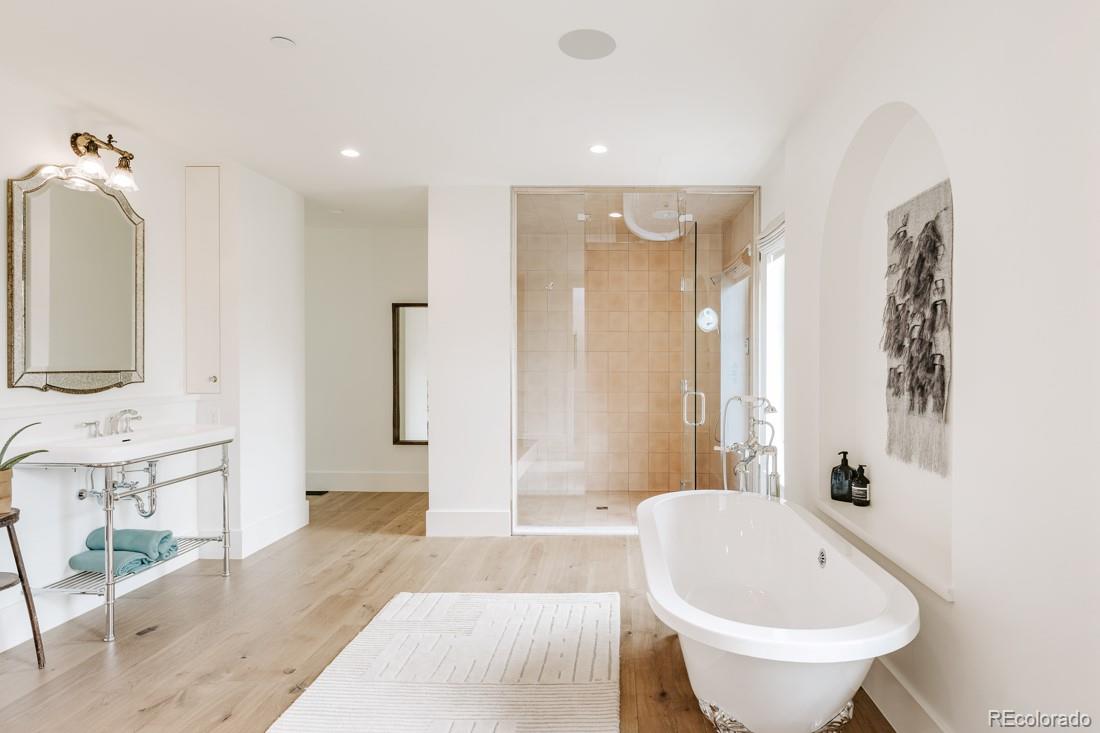 6122 Monarch Road Longmont, CO 80503 - Photo 20 of 40 a bathroom with a bathtub shower sink and toilet