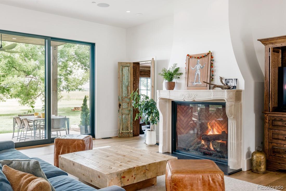 6122 Monarch Road Longmont, CO 80503 - Photo 29 of 40 a living room with furniture and a fireplace