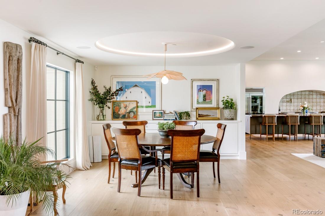 6122 Monarch Road Longmont, CO 80503 - Photo 30 of 40 a view of a dining room with furniture and a potted plant