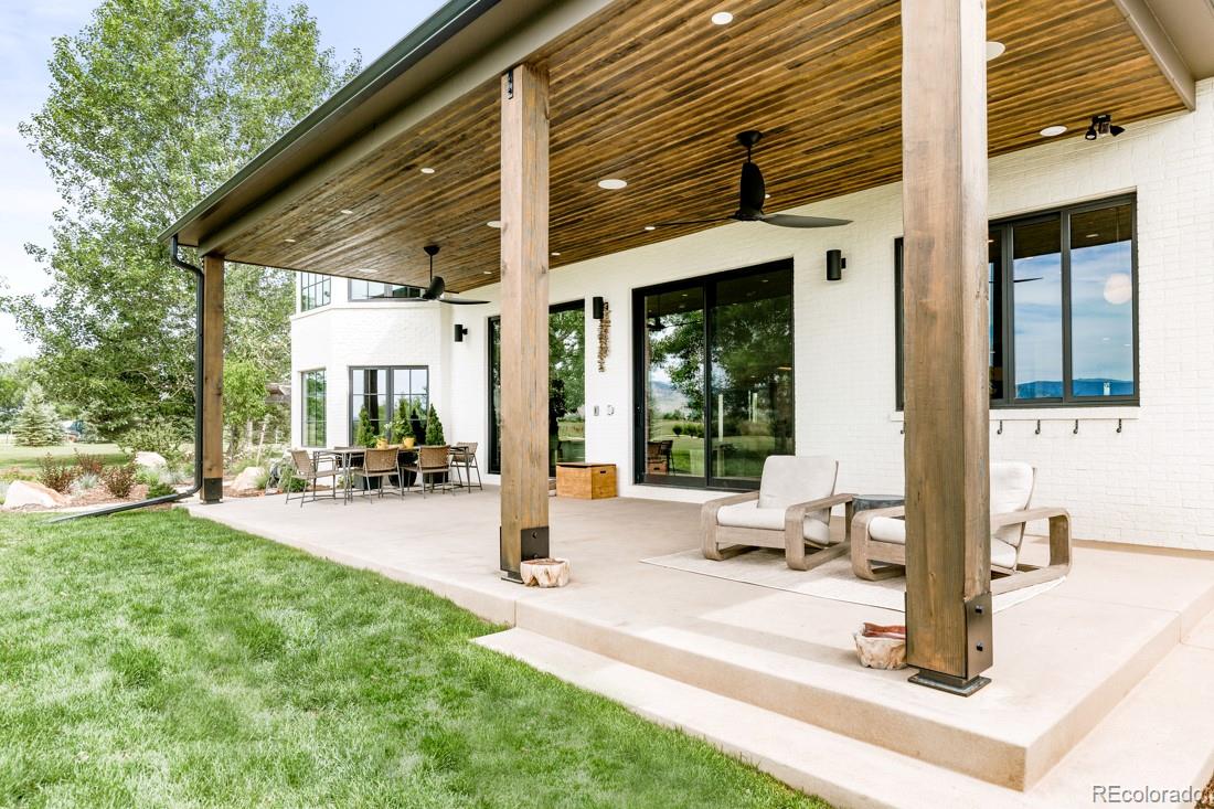 6122 Monarch Road Longmont, CO 80503 - Photo 31 of 40 a view of a backyard with a patio