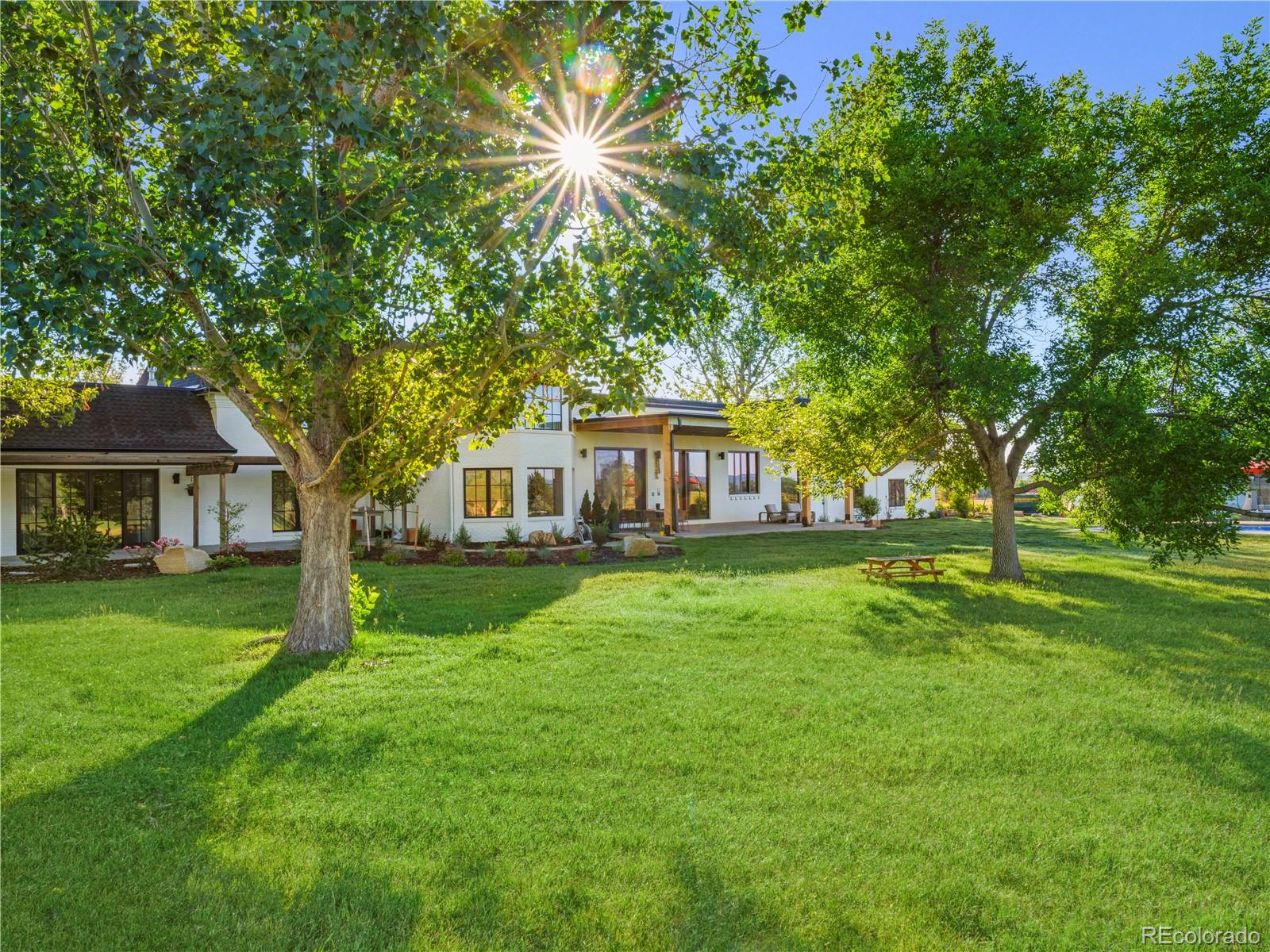 6122 Monarch Road Longmont, CO 80503 - Photo 32 of 40 a front view of a house with garden