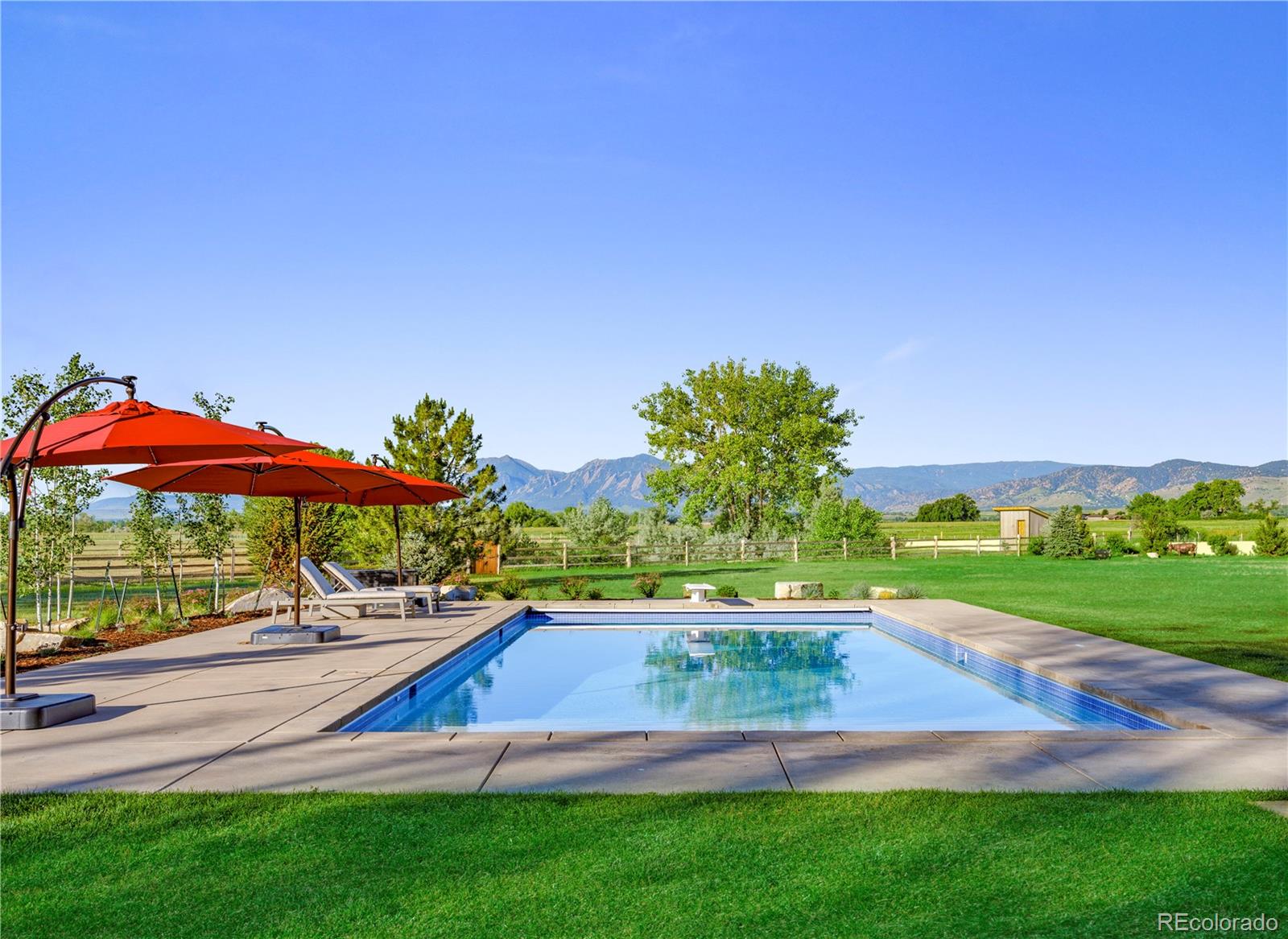 6122 Monarch Road Longmont, CO 80503 - Photo 4 of 40 a view of yard with swimming pool outdoor seating