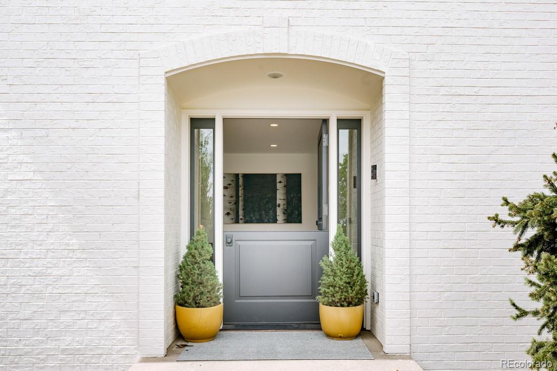 6122 Monarch Road Longmont, CO 80503 - Photo 5 of 40 a view of a entryway door of the house with outdoor seating