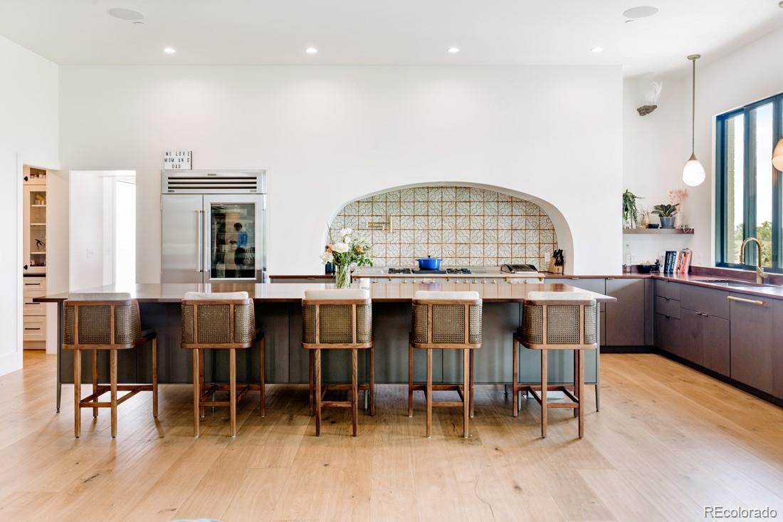 6122 Monarch Road Longmont, CO 80503 - Photo 7 of 40 a living room with a dining table chairs and a kitchen view