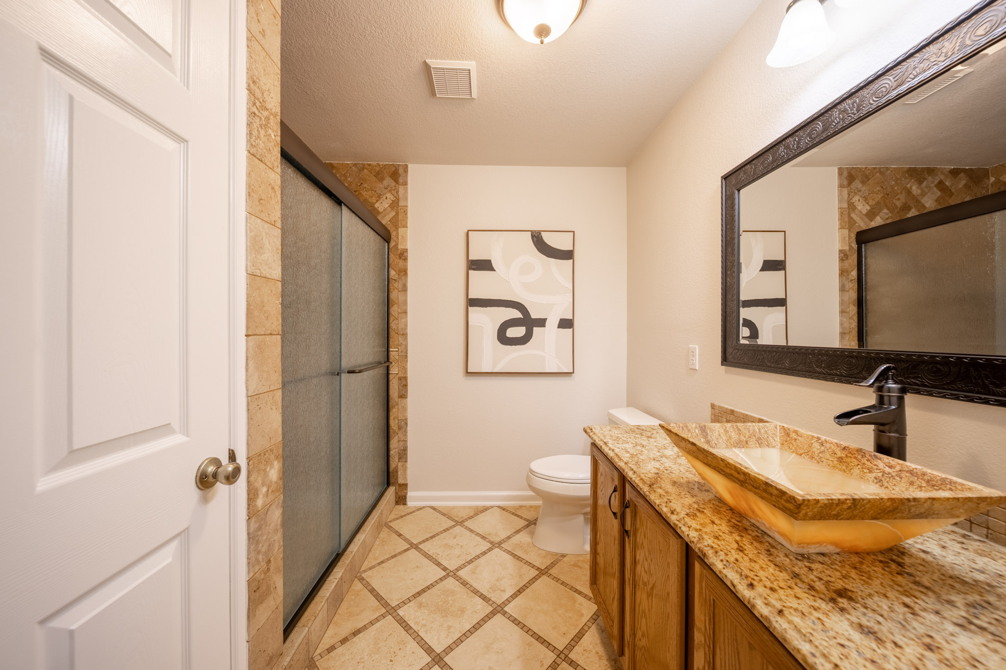 1302 Newbury Street Georgetown, TX 78626 - Photo 16 of 20 a bathroom with a granite countertop sink and a mirror
