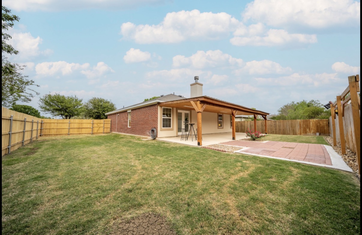 1302 Newbury Street Georgetown, TX 78626 - Photo 2 of 20 a front view of house with yard and trees
