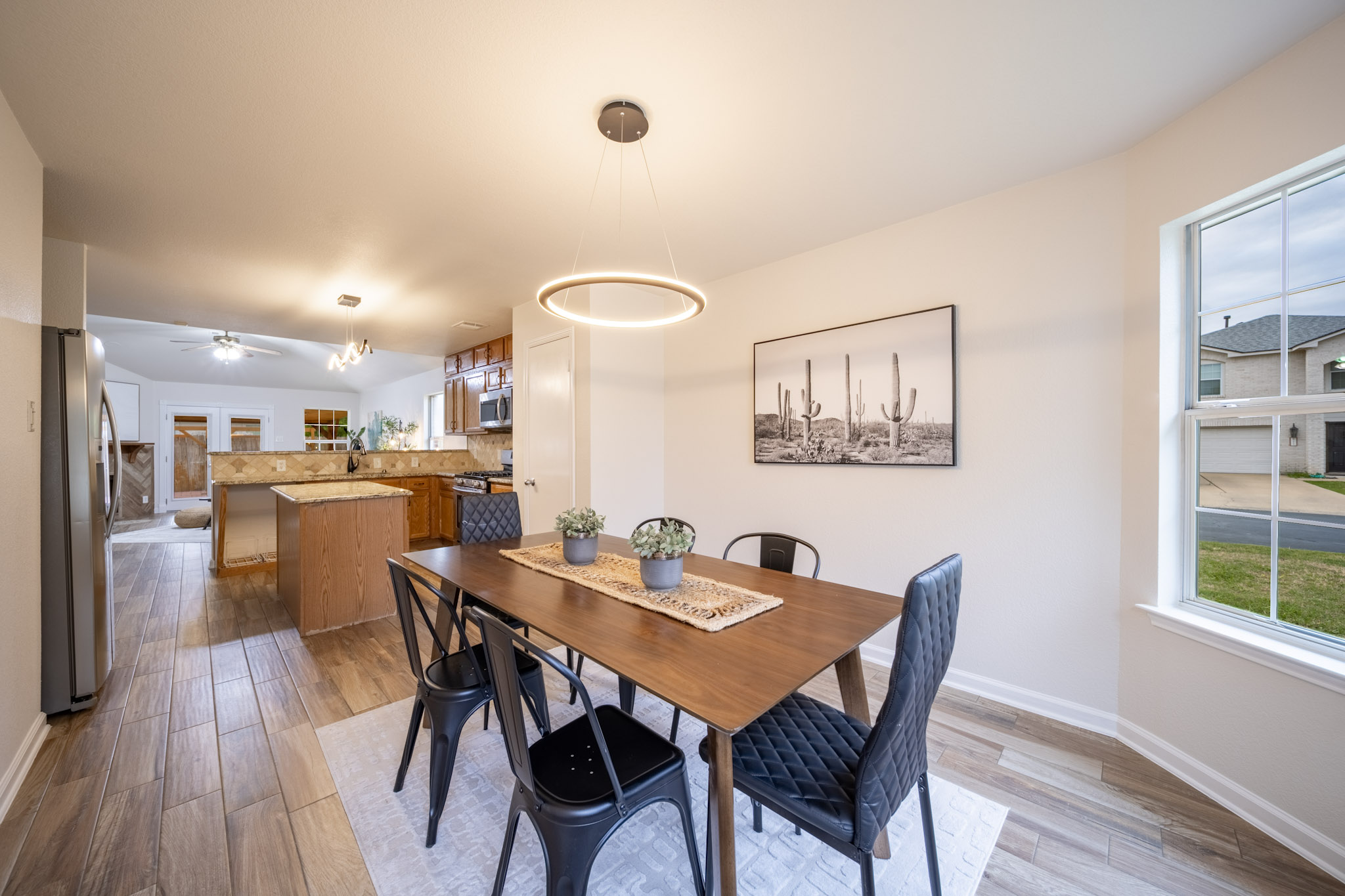 1302 Newbury Street Georgetown, TX 78626 - Photo 3 of 20 a view of a dining room with furniture and wooden floor