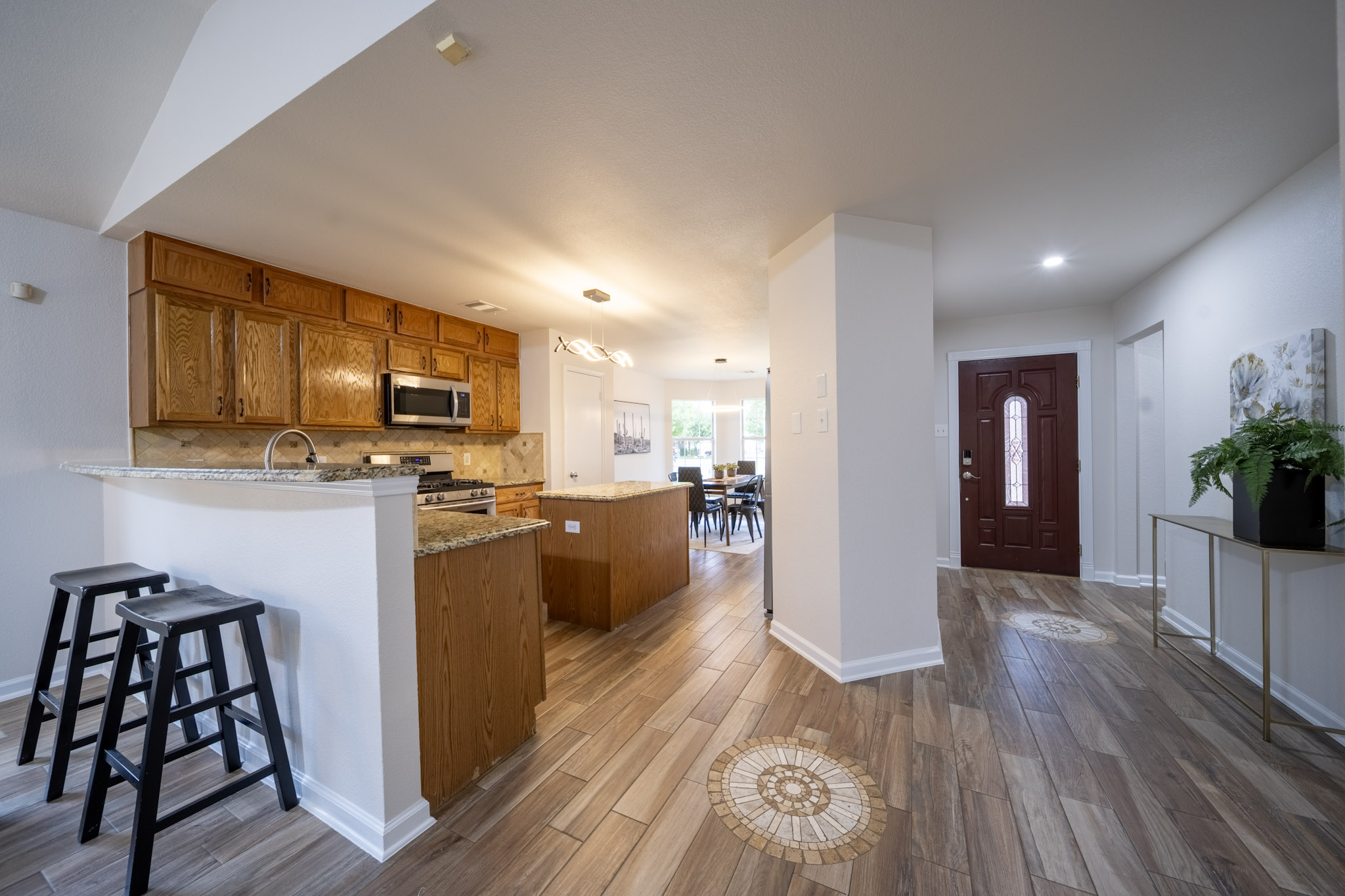 1302 Newbury Street Georgetown, TX 78626 - Photo 4 of 20 a view of kitchen with wooden floor and electronic appliances