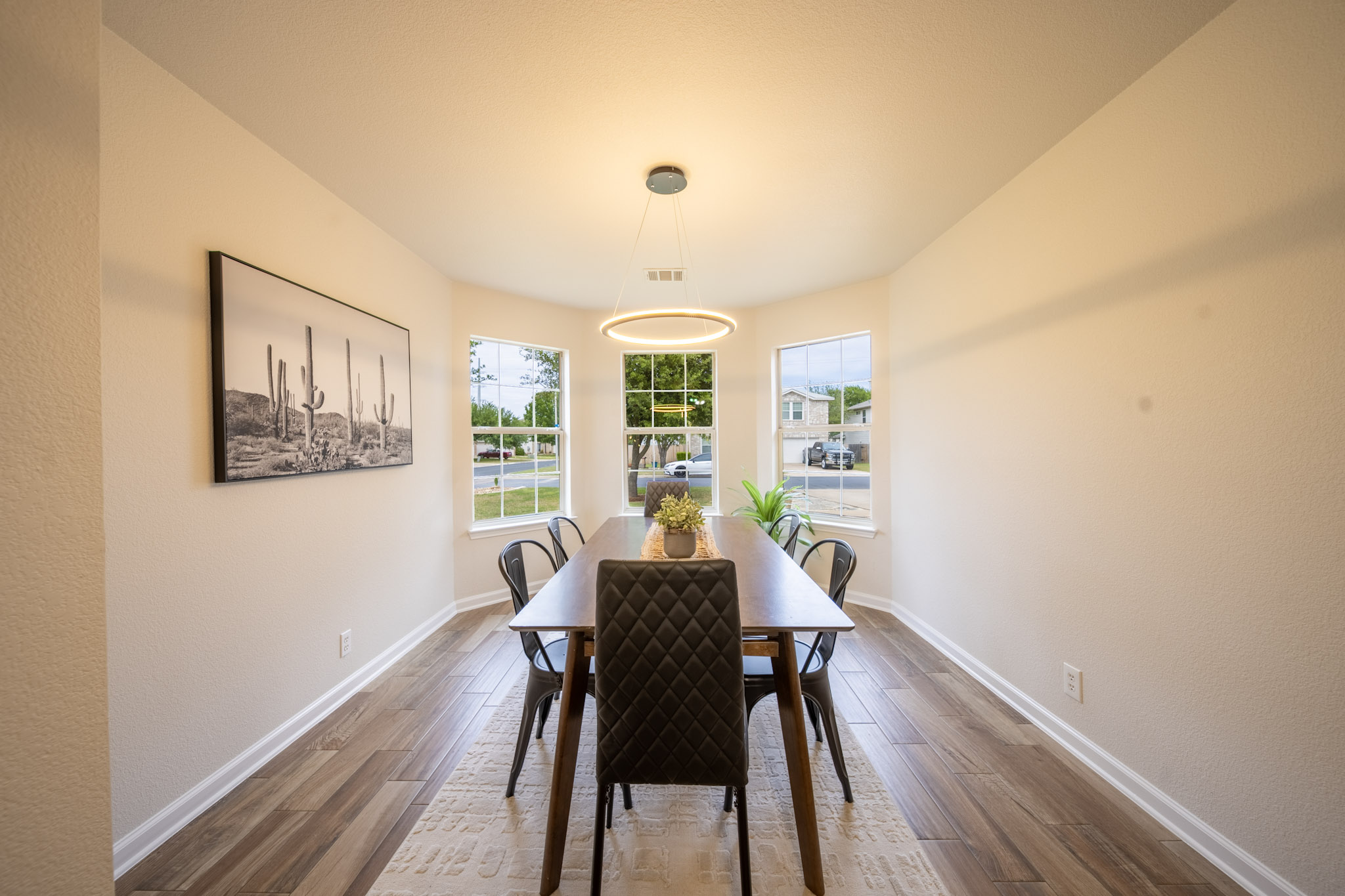 1302 Newbury Street Georgetown, TX 78626 - Photo 5 of 20 a view of a dining room with furniture window and wooden floor