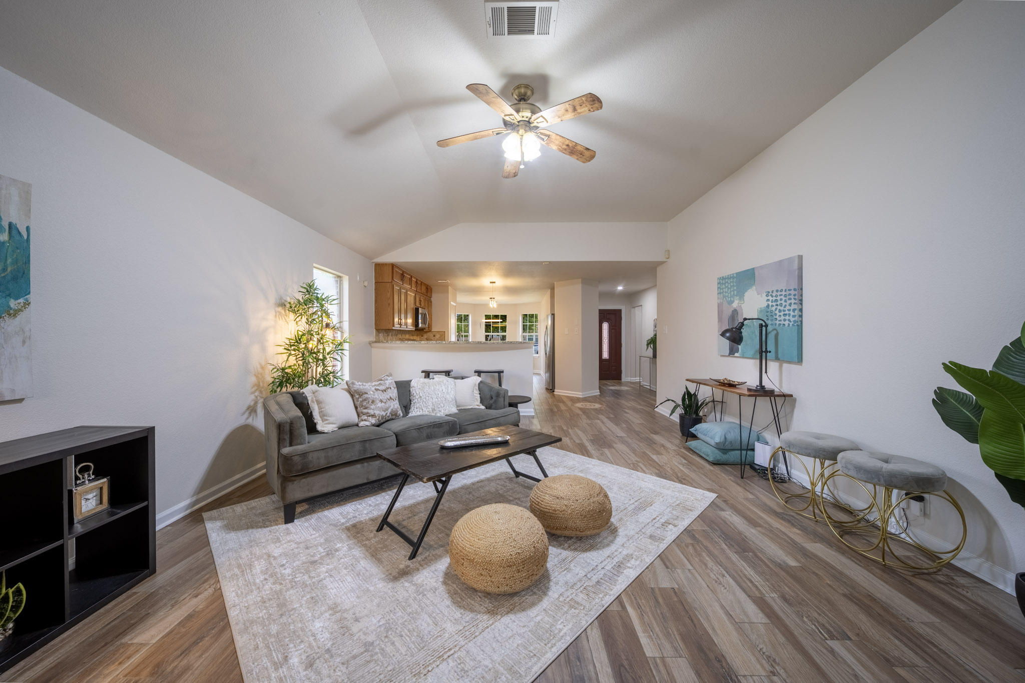 1302 Newbury Street Georgetown, TX 78626 - Photo 9 of 20 a living room with furniture and a chandelier