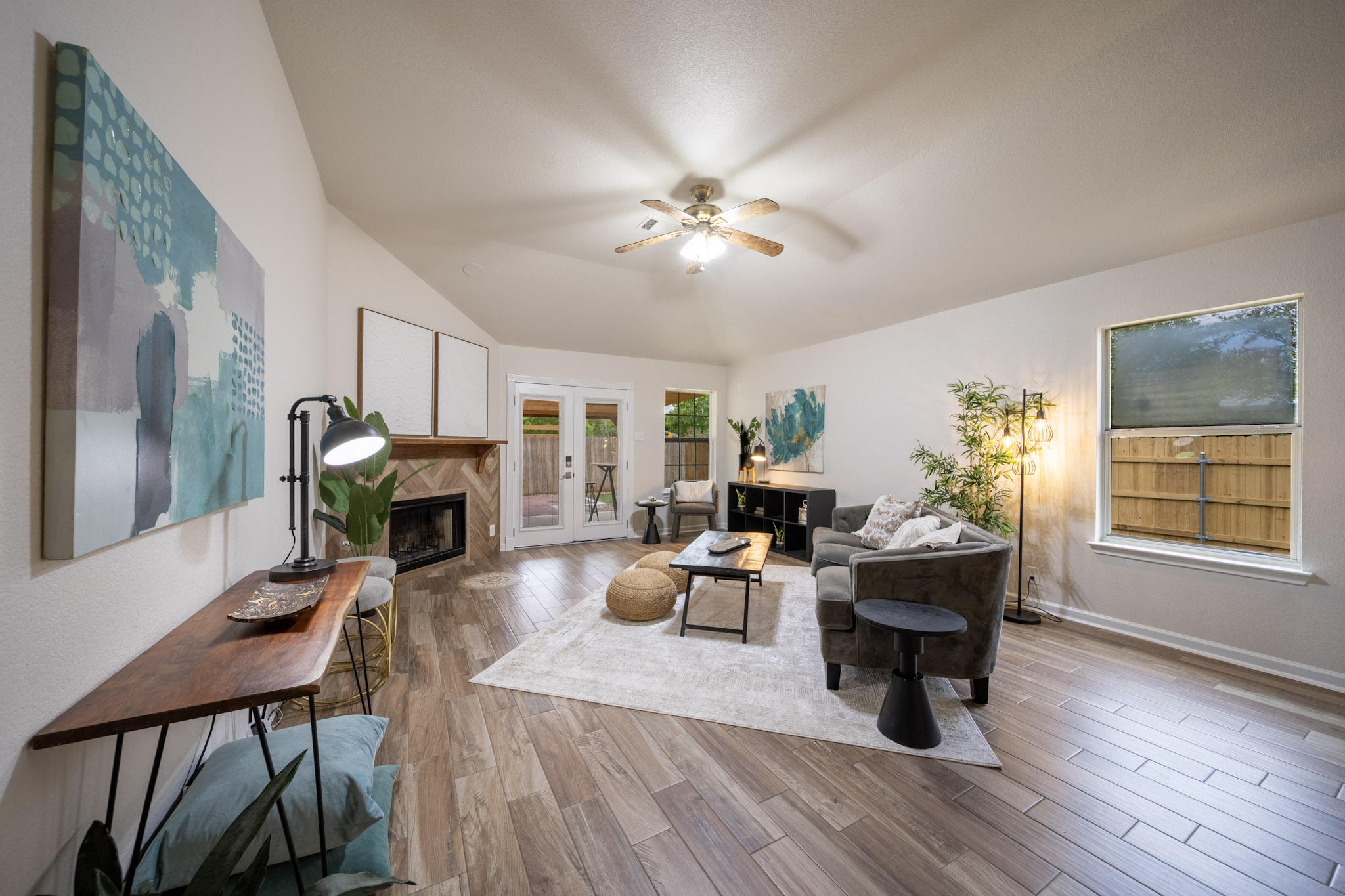 1302 Newbury Street Georgetown, TX 78626 - Photo 10 of 20 a living room with furniture a fireplace and a table