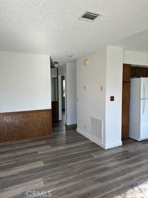 14952 Ritter Street, Unit C Victorville, CA 92394 - Photo 2 of 8 a view of an empty room with wooden floor and closet