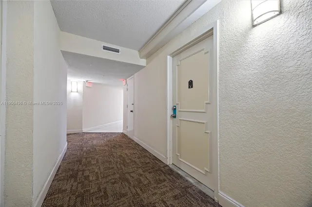 a utility room with cabinets washer and dryer