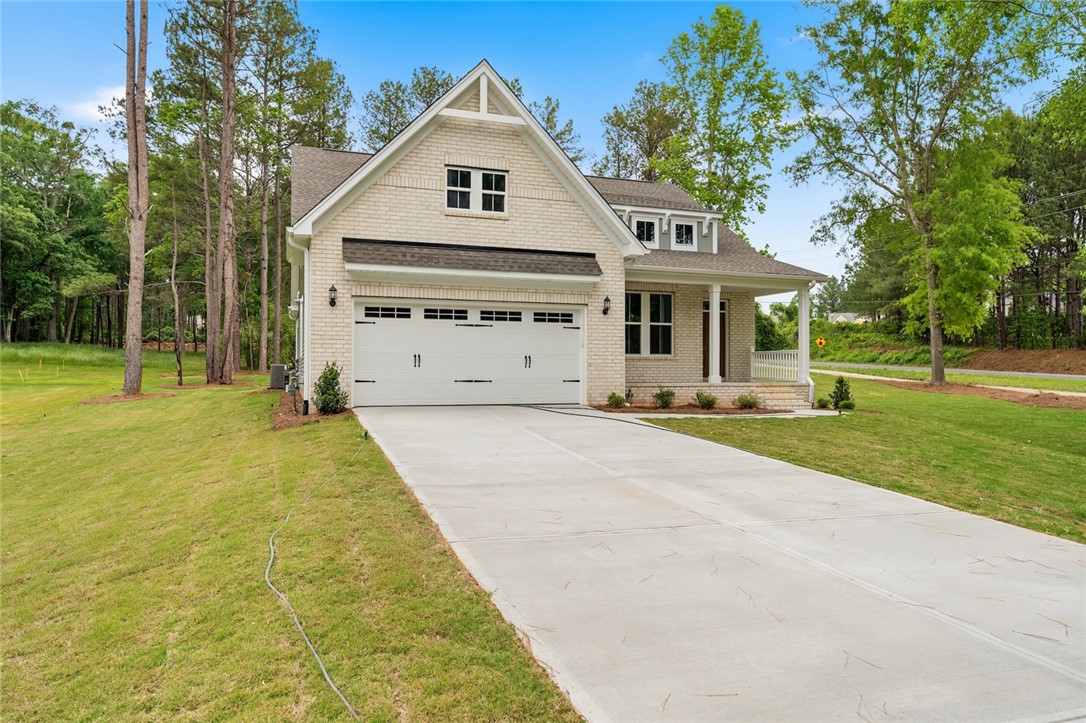 110 Lakeside Drive Anderson, SC 29621 - Photo 2 of 34 This newly constructed home features a crisp brick facade, an inviting covered porch, and a practical two-car garage.