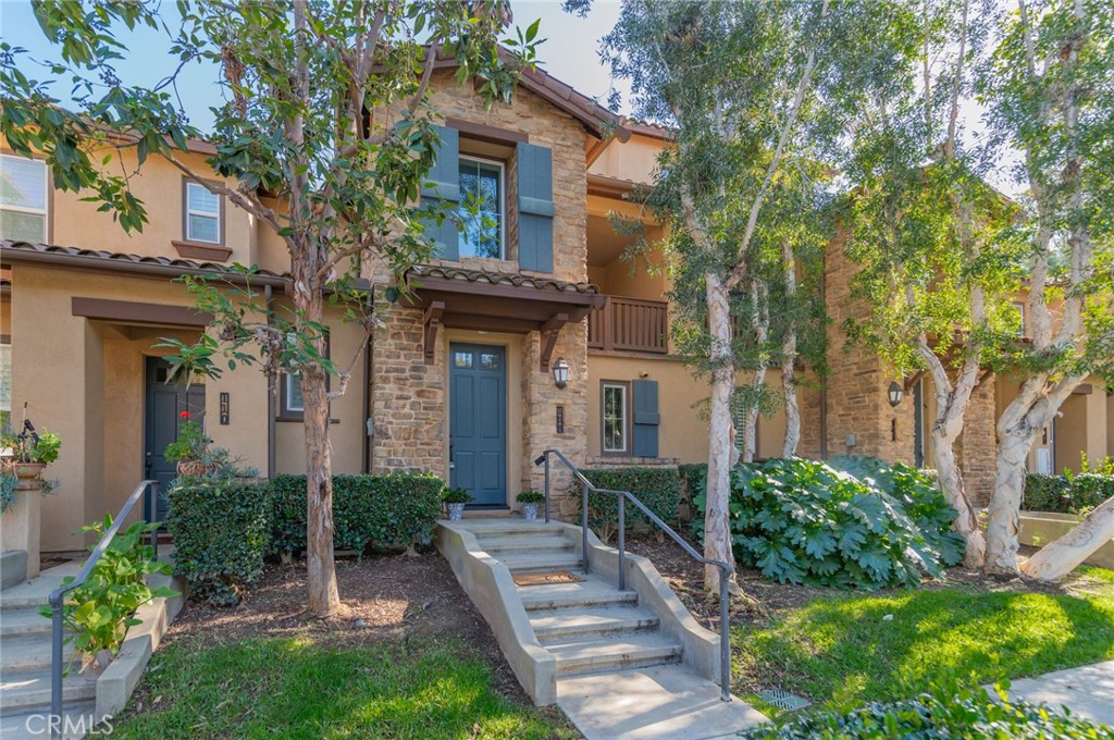108 Jadestone Irvine, CA 92603 - Photo 2 of 24 a front view of a house with garden