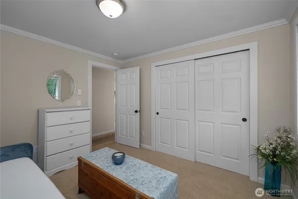 a living room with furniture and potted plant