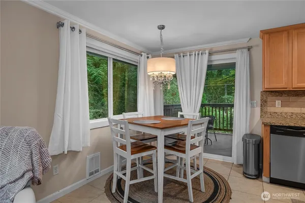 a view of a dining room with furniture window and outside view